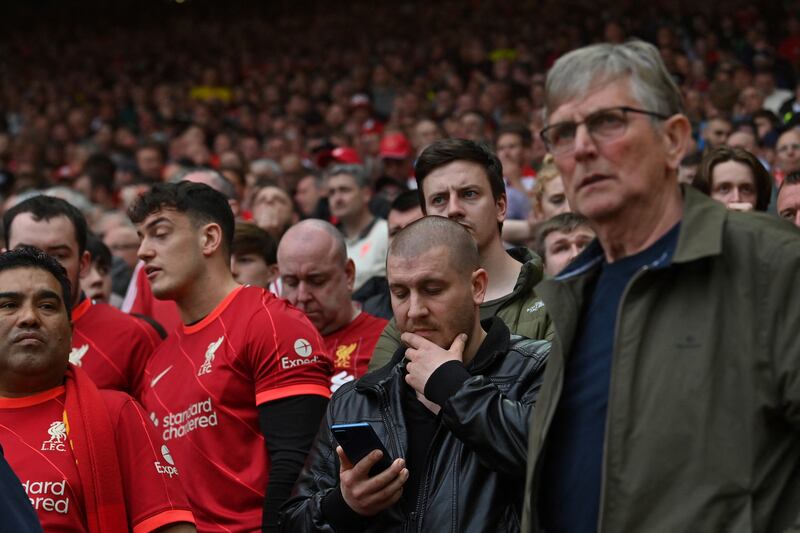 Liverpool fans react as they discover Manchester City is closing on yet another title. File photograph: Getty Images