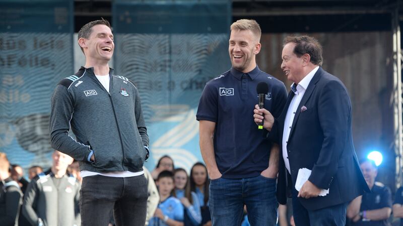 Dublin captain Stephen Cluxton with Johnny Cooper and broadcaster Marty Morrissey during the homecoming event at Merrion Square. Photograph: Dara Mac Dónaill