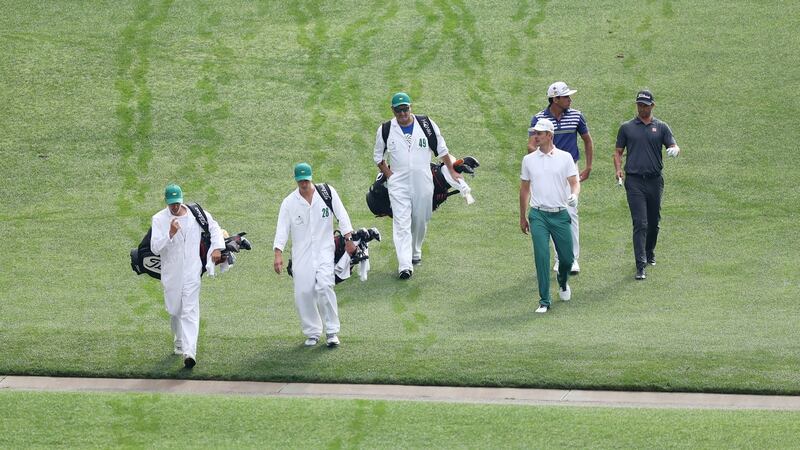 Justin Rose, Rafael Cabrera-Bello and Adam Scott during a practice round on Monday. Photo: David Cannon/Getty Images