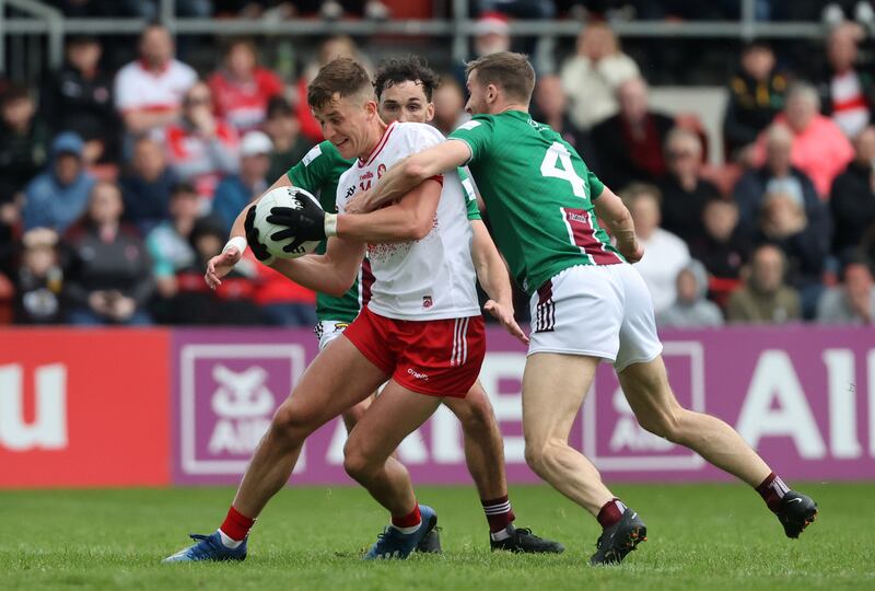 Derry's Shane McGuigan under pressure from Westmeath's Kevin Maguire. Photograph: Bryan Keane/Inpho