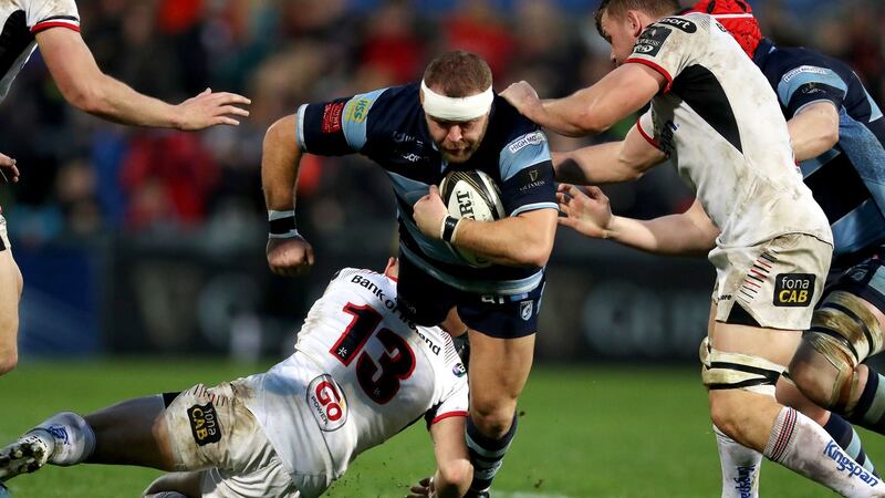 Scott Andrews of Cardiff Blues is tackled. Photograph: Bryan Keane/Inpho