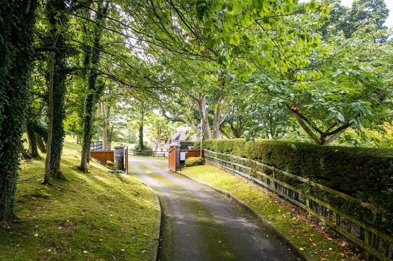 The property lies at the end of a meandering tree-lined driveway
