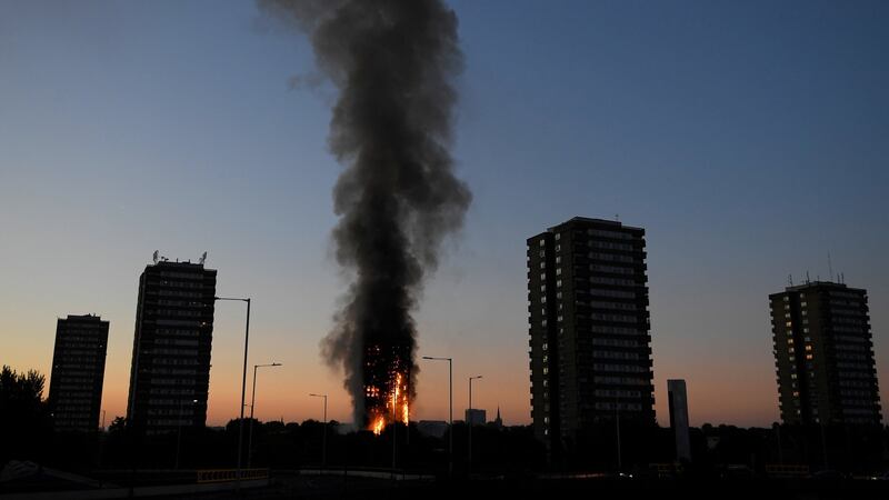 Flames and smoke billow as firefighters deal with a serious fire in a tower block at Latimer Road in West London. Photograph: Toby Melville/Reuters