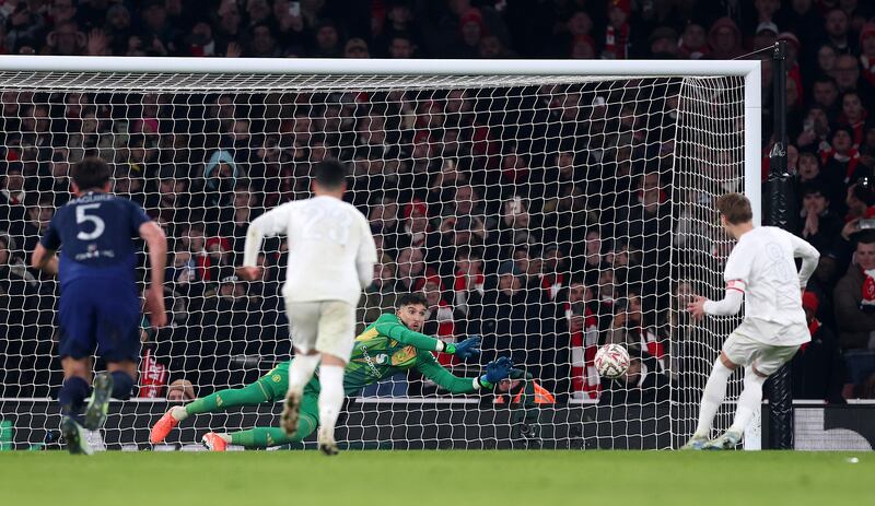 Manchester United's Altay Bayindir saves a penalty from Arsenal's Martin Odegaard during normal time of Sunday's FA Cup clash. Photo by Julian Finney/Getty Images
