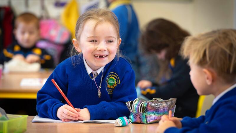 Olivia Crawford enjoying her first day back at school in senior infants class at Scoil Cliodhna Community National School in Carrigtwohill, Co Cork Photograph: Michael Mac Sweeney/Provision