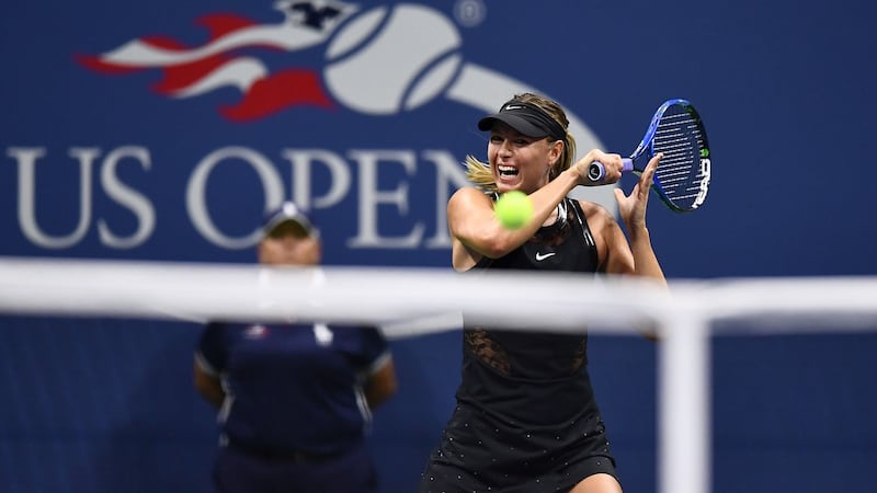Sharapova returns a shot during the match. Photo: Jewel Samad/Getty Images