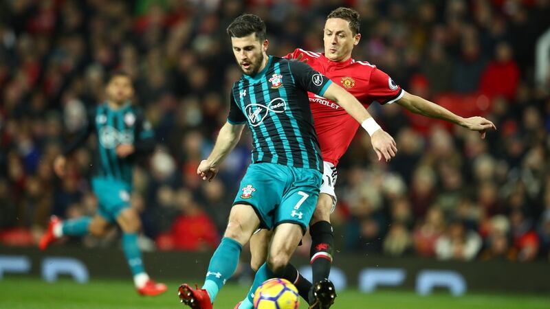 Shane Long holds off Nemanja Matic at Old Trafford. Photograph: Clive Mason/Getty