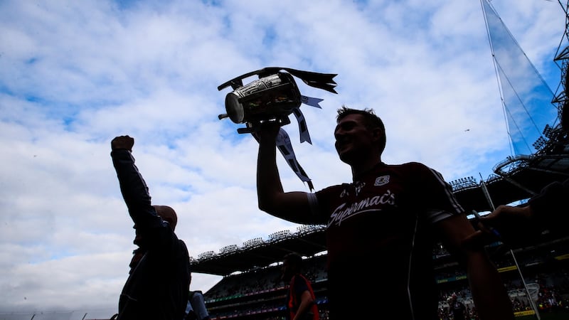 Joe Canning celebrates with the Liam MacCarthy at Croke Park. Photograph: Tommy Dickson/Inpho