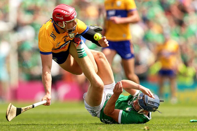 Clare's John Conlon and David Reidy of Limerick in action during the Munster final in Limerick. Photograph: Laszlo Geczo/Inpho