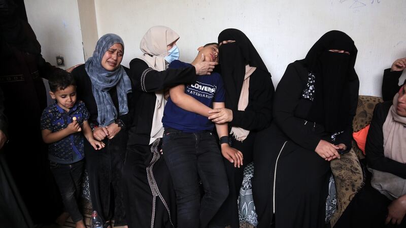 The mother and brother of 13-year-old Yayhya Khalifa are comforted by relatives as they mourn his death in an Israel air strike in Gaza City on May 13th. Photograph: Samar Abu Elouf/New York Times