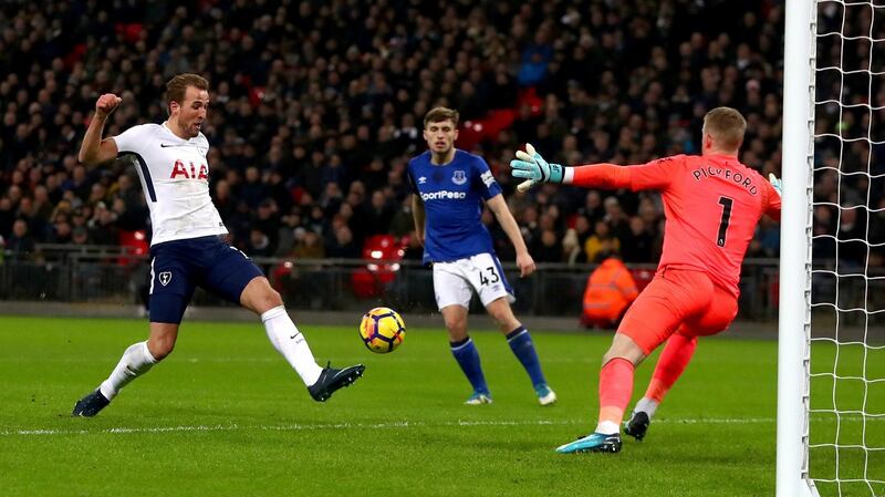 Harry Kane scores Totthenham’s third goal against Everton. Photograph: Neil Hall/EPA
