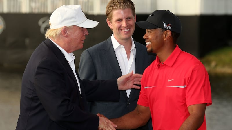 Trump congratulates Tiger Woods after he won the WGC-Cadillac Championship at Doral in 2013. Photo: Warren Little/Getty Images