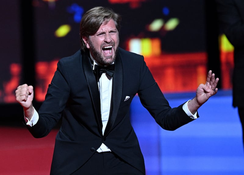 Ruben Ostlund reacting on stage after he won the Palme d'Or for the film Triangle of Sadness. Photograph: Christophe Simon/AFP