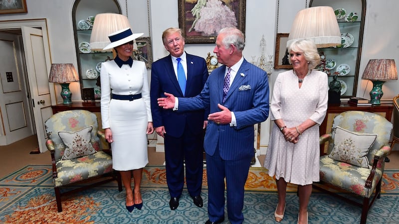 US president Donald Trump and his wife Melania (left) at Clarence House in London to take tea with the Prince of Wales and Duchess of Cornwall on the first day of his state visit to the UK. Photograph: Victoria Jones/PA Wire