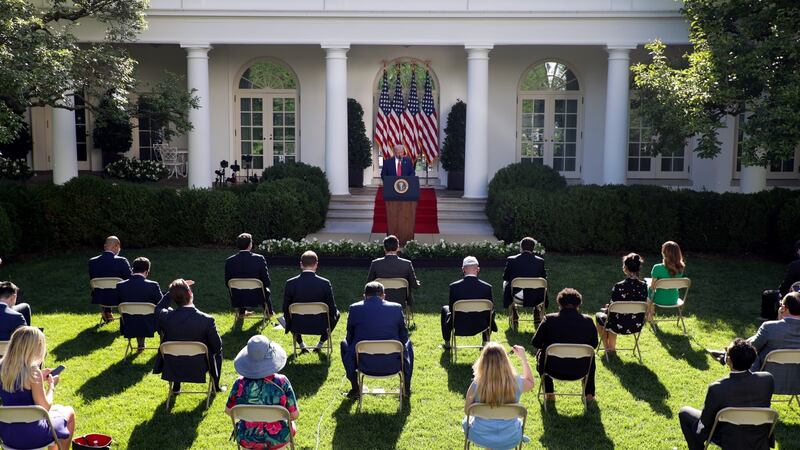 Journalists listen to Donald Trump in the Rose Garden of the White House on Tuesday. Photograph:  Tasos Katopodis/UPI/Bloomberg