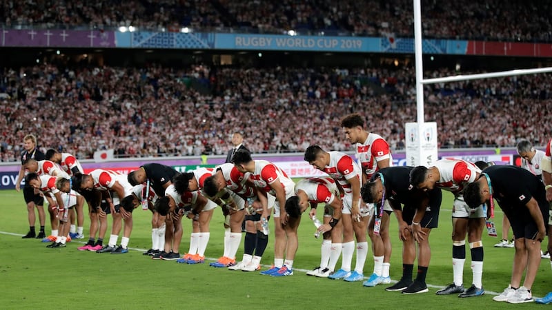 Japan players and staff bow to their fans. Photo: Jae Hong/AP Photo