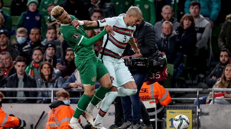 Pepe fouls Ireland’s Callum Robinson leading to a second yellow card and a sending off for the Portugal defender. Photograph: Dan Sheridan/Inpho