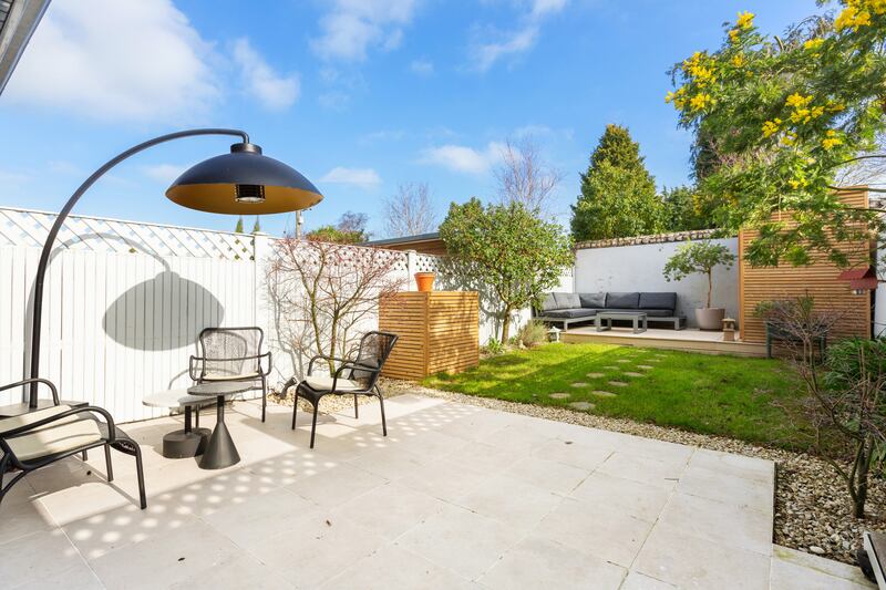 East-facing garden with patio and raised deck