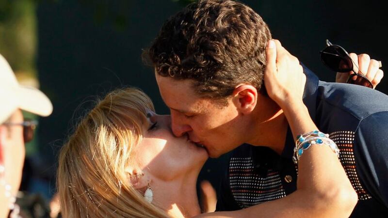 ustin Rose kisses his wife Kate as he walks off the 18th green.  Photograph: Adam Hunger/Reuters