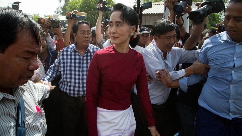 Burma’s National League for Democracy party leader Aung San Suu Kyi visits a polling station outside Rangoon: She is barred from taking the presidency herself under the constitution written by the junta to preserve its power.  Photograph: Mark Baker/AP