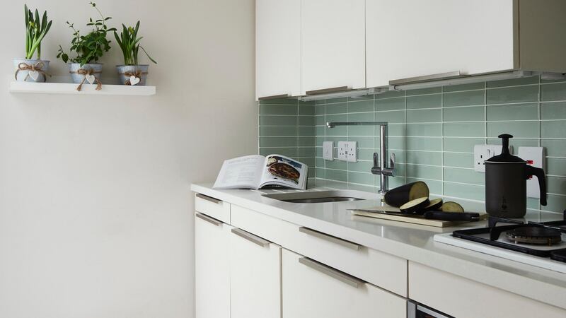 The kitchen counter was raised above the 90cm standard to fit in 10cm drawers. Photograph: Philip Lauterbach