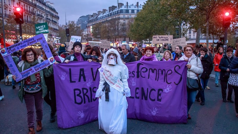 Women’s rights activists hold placards with purple signs of  feminist movement Nous Toutes (All of Us) as they march during a rally against femicide, gender-based violence and sexual harassment against women, in Paris, France, on Saturday. Photograph: Christophe Petit Tesson/EPA
