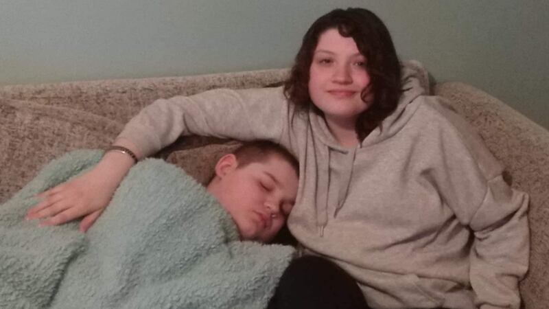 Kyra Mania (18) with her brother Luca (12), who has severe autism and is non-verbal.