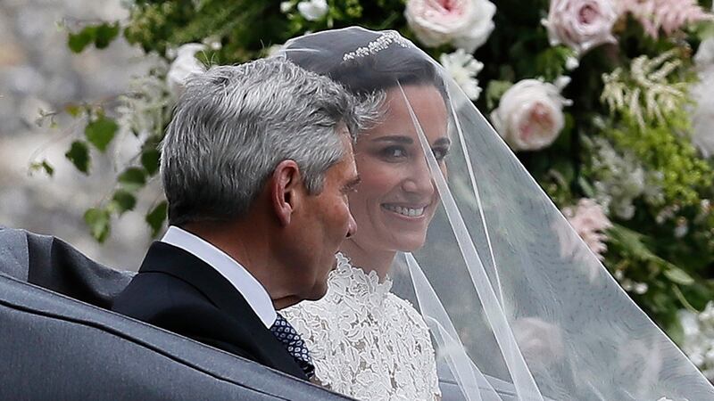 Pippa Middleton arrives with her father Michael Middleton for her wedding at St Mark’s Church in Englefield, west of London. Photograph: Kirsty Wigglesworth/PA