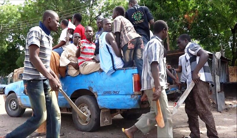 Neighbourhood vigilantes get  into a truck  to search for Boko Haram members in Maiduguri. Photograph: Abubakar/Getty Images)