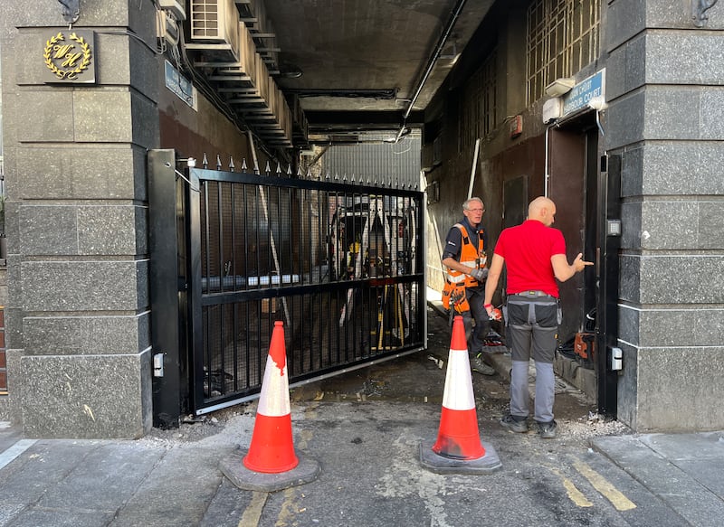 Workers erect gate at the Abbey Street entrance to Harbour Court in Dublin city centre. Photograph: Bryan O’Brien
