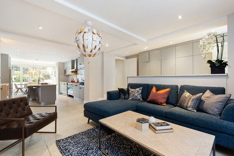 Downstairs living room leading to kitchen.
