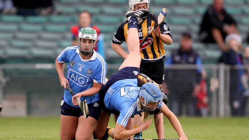 Dublin’s Eva Marie Elliott falls over Julieann Malone of Kilkenn. Photograph: Bryan Keane