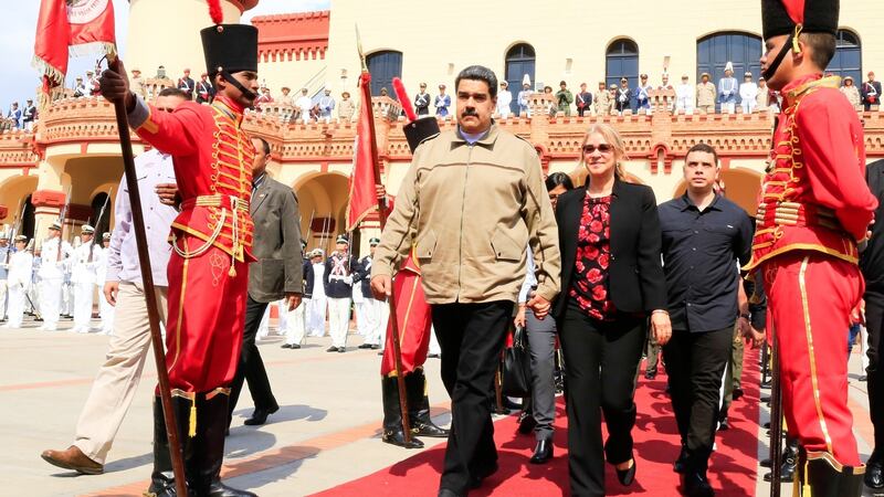 Venezuela’s President Nicolas Maduro  and first lady Cilia Flores during a military ceremony to commemorate the sixth anniversary of the death of President Hugo Chavez. Photograph: Venezuelan Presidency/AFP