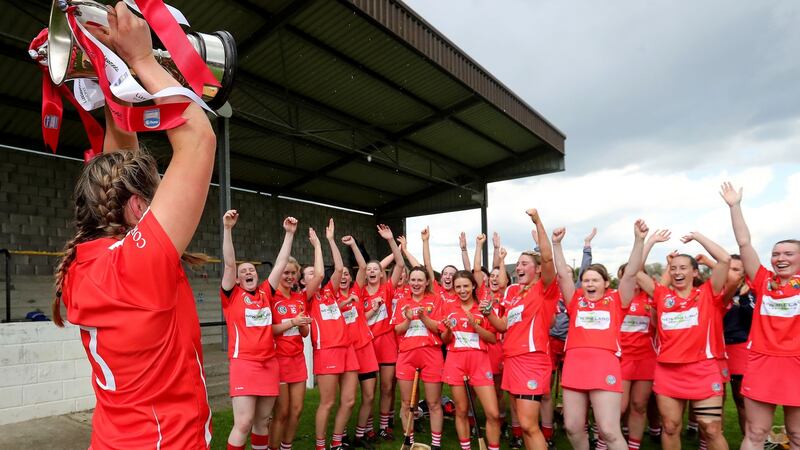 Cork’s Sarah Harrington lifts the Littlewoods Ireland Camogie League 2 trophy at St Lachtain’s GAA,  Co Kilkenny on Sunday. Photograph: Bryan Keane/Inpho