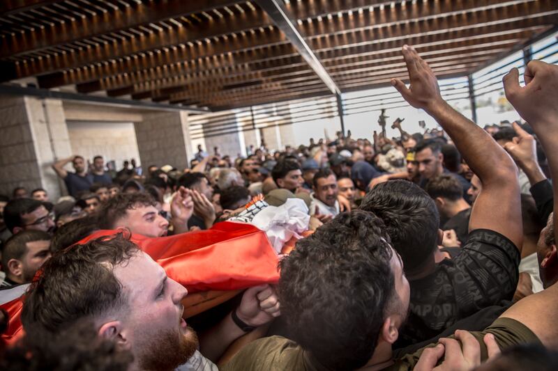 Men carry the bodies of American citizen Sayfollah Musallet (20) and Palestinian Mohammed Hussein Al-Shalabi (23), both killed during settler violence last Friday. Photograph: Sally Hayden