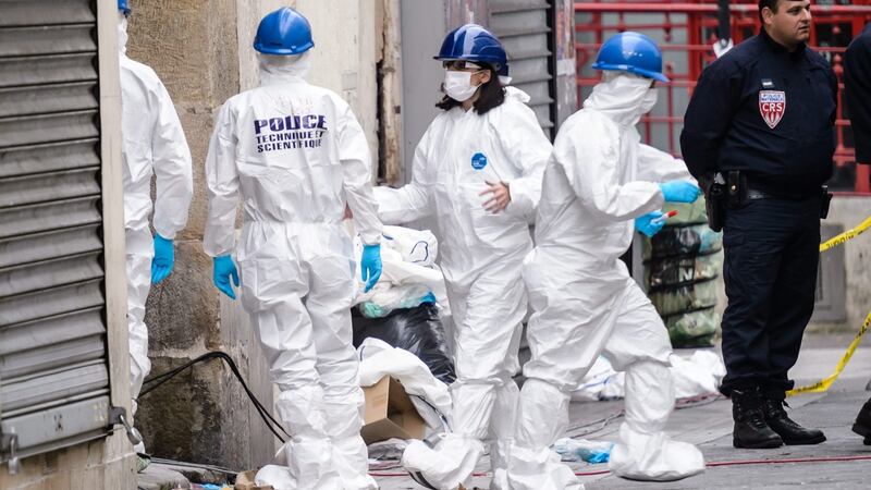 French police forensics seen outside the rue du Corbillon building in Saint-Denis, northern Paris suburb. Photograph: EPA