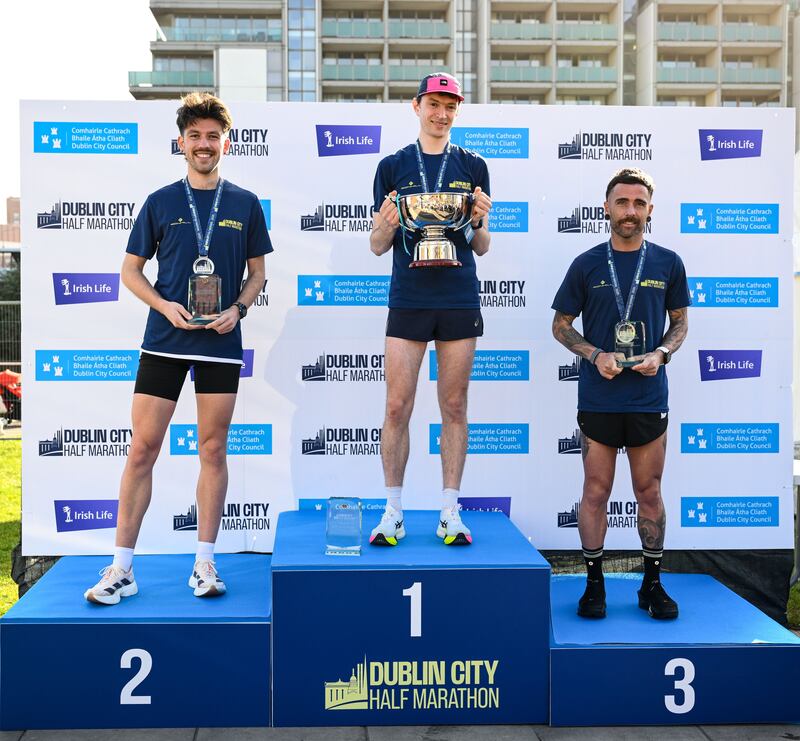 Men's race winner Killian Mooney, with second placed Kevin Kelly (left) and third placed Michael Fox. Photograph: Ramsey Cardy/Sportsfile