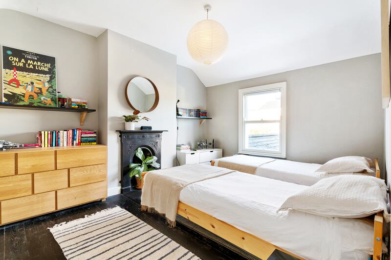 Twin bedroom upstairs: The family love the area so much they decided to move to a larger home nearby.
