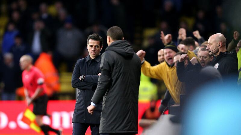 Watford fans celebrate as Everton manager Marco Silva looks on. Photo: Nigel French/PA Wire