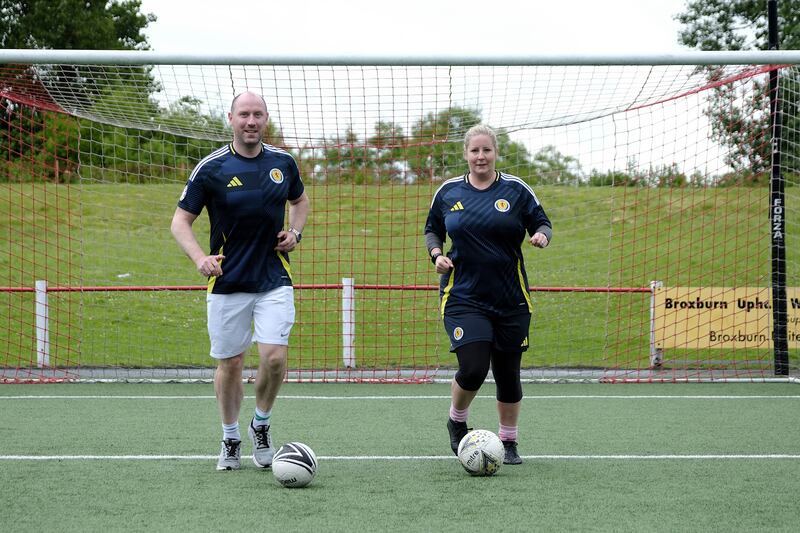 SNP secretary for health Neil Gray and SNP candidate Hannah Bardell campaigning at Albyn Park, Broxburn on Friday. Photograph: Alex Todd/Sipa