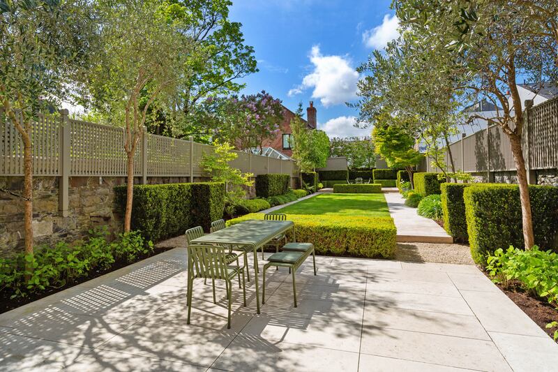 Formal gardens were designed by Damien Costello. Photograph: Angela Mujica