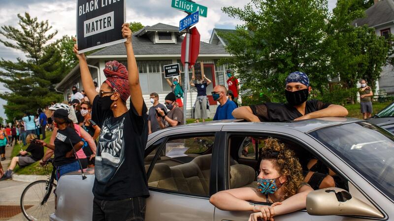 Protester in Minneapolis on Tuesday eveing. Photograph:    Kerem Yucel/AFP via Getty Images