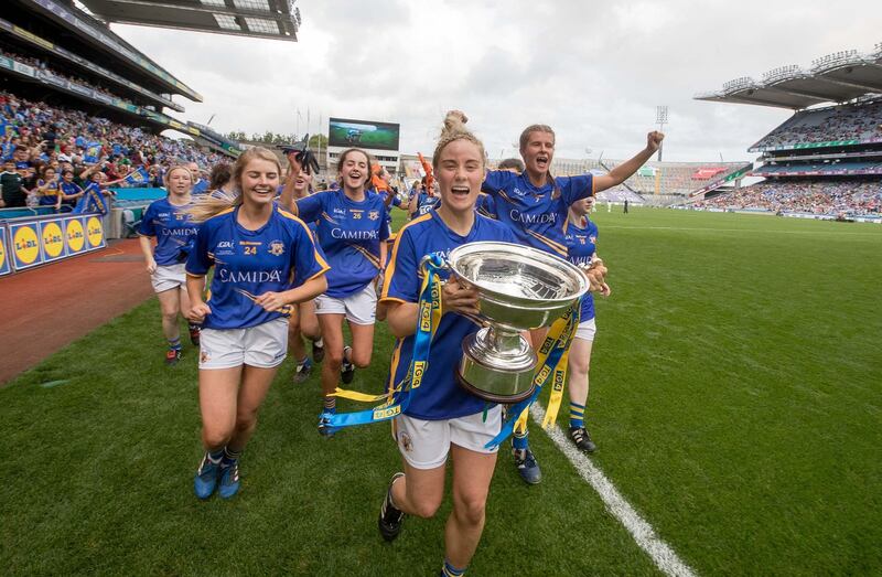 Tipperary’s Samantha Lambert lifts the All-Ireland Intermediate football cup in 2017 in Croke Park. Photograph: Morgan Treacy/Inpho