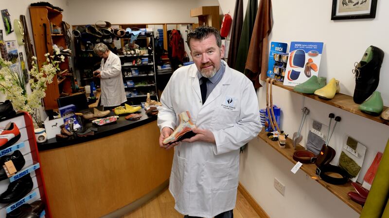 Neil O’Donnell at his specialist shoe shop in Dún Laoghaire. Photograph: Cyril Byrne