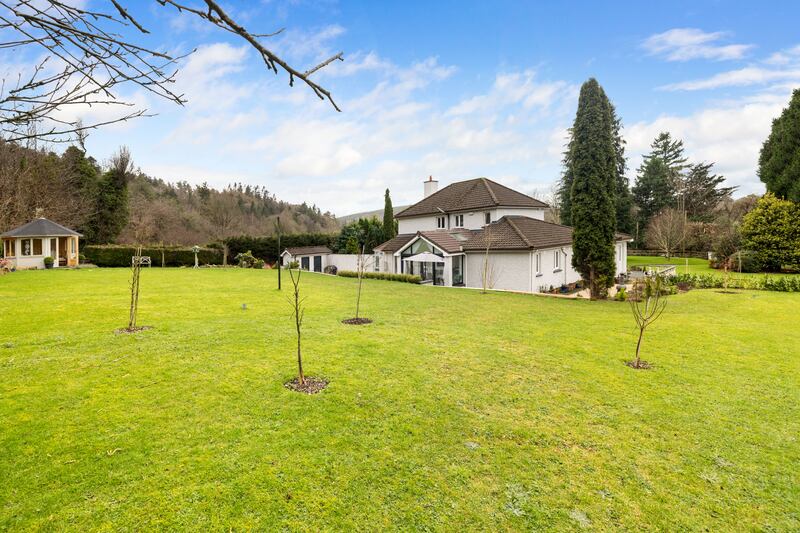 The summer house, to the left, makes the most of the views as far as Glenmalure. Photograph: Andrew Nolan Photography