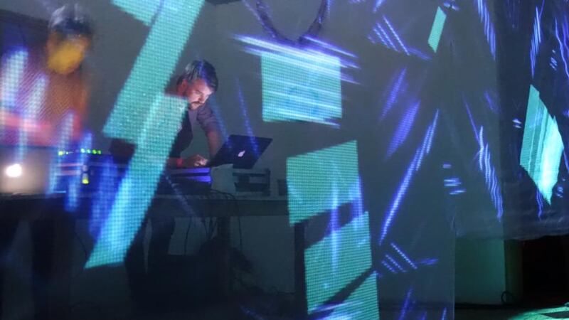 Clu’s pinpoint projections and music transform the functional Hall Scoile