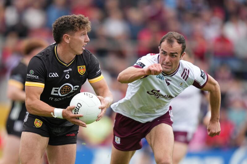 Down's Pierce Laverty in action against Galway's John Maher. Photograph: James Lawlor/Inpho
