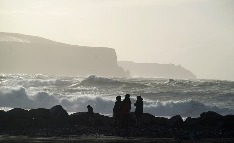 People watching high waves in Doolin in Co Clare ahead of Storm Elin and Storm Fergus: When any national met service names a weather system, others keep that name. Photograph: Niall Carson/PA Wire 
