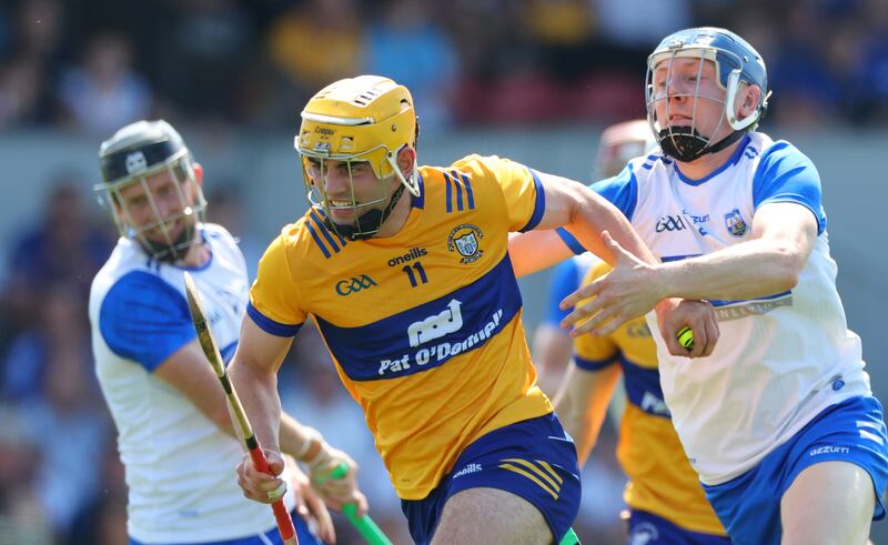 Clare’s Mark Rodgers and Kieran Bennett of Waterford tussle for advantage during the championship match last April at Cusack Park in Ennis. Photograph: James Crombie/Inpho