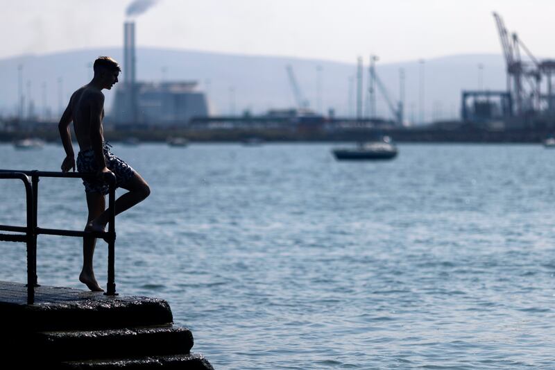 Teenagers swimming in Clontarf, Dublin. Photograph: Chris Maddaloni